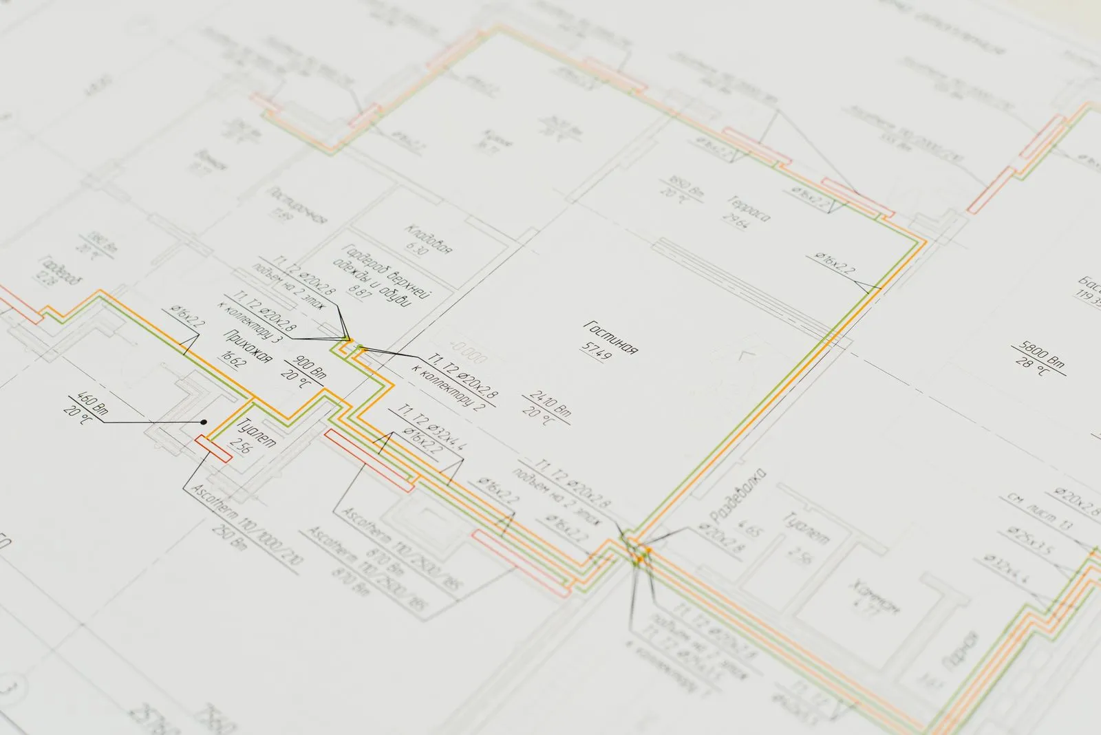 Close-up of a detailed architectural blueprint showing design plans on a desk. Ideal for construction and design concepts.
